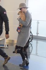 JENNIFER LAWRENCE with Her Dog at JFK Airport in New York 12/30/2017