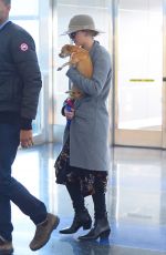 JENNIFER LAWRENCE with Her Dog at JFK Airport in New York 12/30/2017