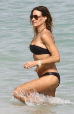 KELLY BENSIMON in Bikinis at a Beach in Miami 12/27/2017