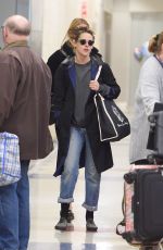 KRSITEN STEWART and STELLA MAXWELL at JFK Airport in New York 12/08/2017