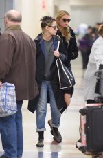 KRSITEN STEWART and STELLA MAXWELL at JFK Airport in New York 12/08/2017