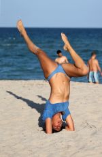 LUCY ARAGON in Bikini Does Yoga at a Beach in Miami 12/08/2017