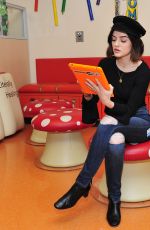 LUCY HALE Spread Holiday Cheer at Children