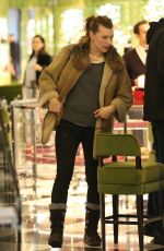 MILLA JOVOVICH and Paul W. S. Anderson Shopping at Prada in Beverly Hills 12/21/2017