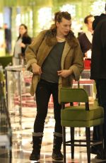 MILLA JOVOVICH and Paul W. S. Anderson Shopping at Prada in Beverly Hills 12/21/2017