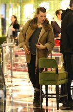MILLA JOVOVICH and Paul W. S. Anderson Shopping at Prada in Beverly Hills 12/21/2017