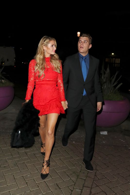PARIS HILTON and Chris Zylka at a Party in West London 12/14/2017