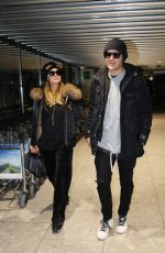 PARIS HILTON and Chris Zylka at Heathrow Airport in London 12/20/2017