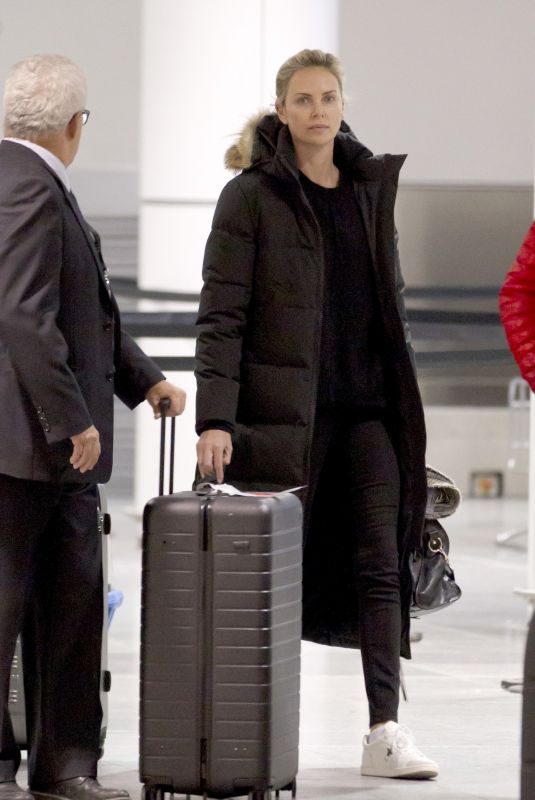 CHARLIZE THERON Arrives at Airport in Montreal 01/11/2018