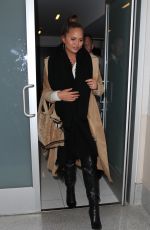 CHRISSY TEIGEN at LAX Airport in Los Angeles 01/18/2018