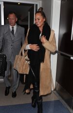 CHRISSY TEIGEN at LAX Airport in Los Angeles 01/18/2018