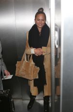 CHRISSY TEIGEN at LAX Airport in Los Angeles 01/18/2018