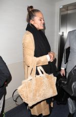 CHRISSY TEIGEN at LAX Airport in Los Angeles 01/18/2018