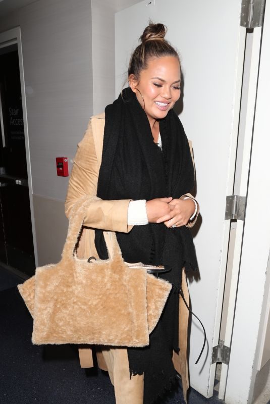 CHRISSY TEIGEN at LAX Airport in Los Angeles 01/18/2018