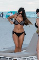 CLAUDIA ROMANI and BELLA BOND in Biknis at a Beach in Miami 01/14/2018