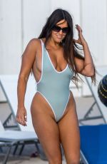 CLAUDIA ROMANI in Swimsuit on the Beach in Miami 12/31/2017