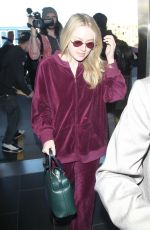 DAKOTA FANNING at LAX Airport in Los Angeles 01/22/2018