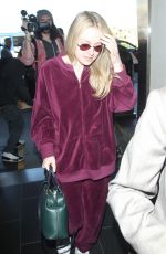 DAKOTA FANNING at LAX Airport in Los Angeles 01/22/2018