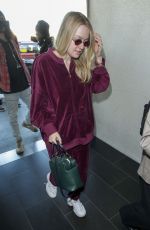 DAKOTA FANNING at LAX Airport in Los Angeles 01/22/2018