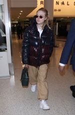 DAKOTA FANNING at Los Angeles International Airport 01/20/2018