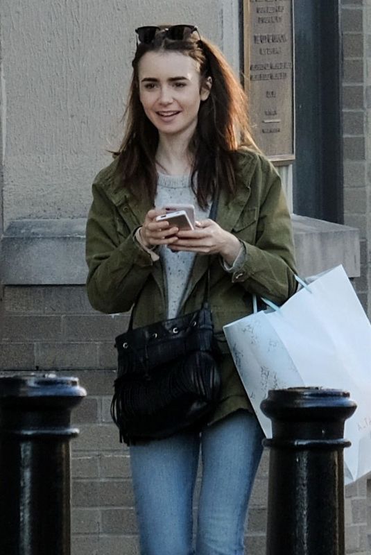 LILY COLLINS Out and About in Cincinnati 01/29/2018