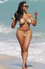 MORIAH MILLS in Gold Bikini at a Beach in Miami 01/17/2018