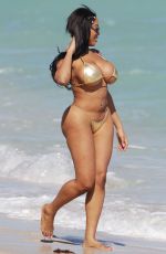 MORIAH MILLS in Gold Bikini at a Beach in Miami 01/17/2018