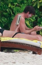 REBECCA ROMIJN in Bikini on the Beach in Tulum 01/01/2018