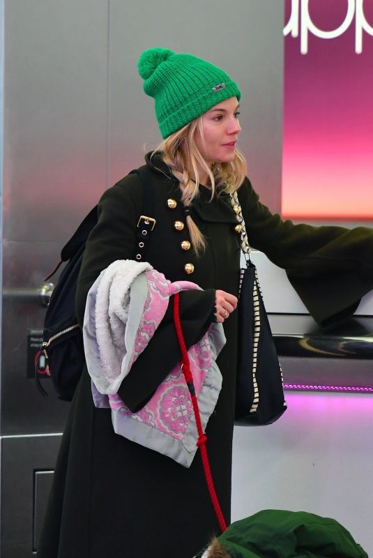 SIENNA MILLER at Heathrow Airport in London 01/06/2018