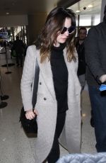 ANNE HATHAWAY Arrives at LAX Airport in Los Angeles 02/25/2018