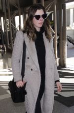 ANNE HATHAWAY Arrives at LAX Airport in Los Angeles 02/25/2018