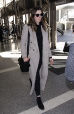 ANNE HATHAWAY Arrives at LAX Airport in Los Angeles 02/25/2018