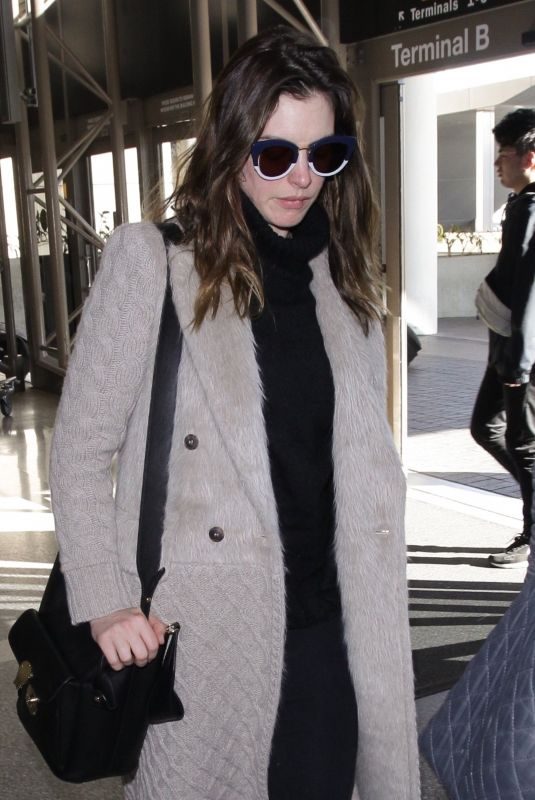 ANNE HATHAWAY Arrives at LAX Airport in Los Angeles 02/25/2018