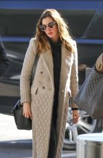 ANNE HATHAWAY Arrives at LAX Airport in Los Angeles 02/25/2018