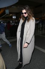 ANNE HATHAWAY Arrives at LAX Airport in Los Angeles 02/25/2018