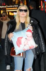 ASHLEY BENSON Out at Times Square in New York 02/09/2018