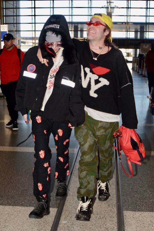 BELLA THORNE and Mod Sun at LAX Airport in Los Angeles 02/25/2018