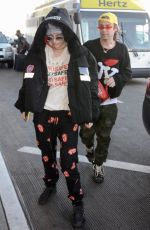 BELLA THORNE and Mod Sun at LAX Airport in Los Angeles 02/25/2018