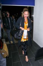 CHRISSY TEIGEN at LAX Airport in Los Angeles 02/24/2018