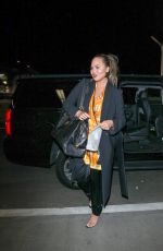 CHRISSY TEIGEN at LAX Airport in Los Angeles 02/24/2018