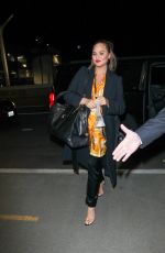 CHRISSY TEIGEN at LAX Airport in Los Angeles 02/24/2018