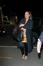 CHRISSY TEIGEN at LAX Airport in Los Angeles 02/24/2018