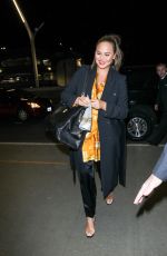 CHRISSY TEIGEN at LAX Airport in Los Angeles 02/24/2018