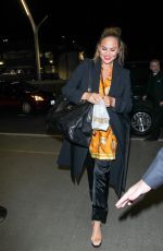 CHRISSY TEIGEN at LAX Airport in Los Angeles 02/24/2018