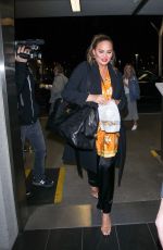 CHRISSY TEIGEN at LAX Airport in Los Angeles 02/24/2018