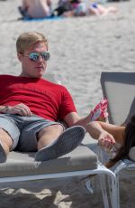 CLAUDIA ROMANI and Chris Johns at a Beach in Miami 02/07/2018