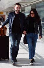 COURTENEY COX and Johnny McDaid at Heathrow Airport in London 02/17/2018