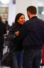 COURTENEY COX and Johnny McDaid at Heathrow Airport in London 02/17/2018