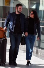 COURTENEY COX and Johnny McDaid at Heathrow Airport in London 02/17/2018
