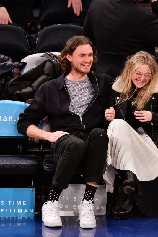 DAKOTA FANNING at New York Knicks vs Milwaukee Bucks Game in New York 02/06/2018